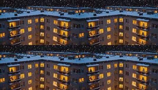 雪夜中亮灯的居民楼场景高清在线视频素材下载