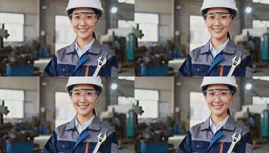 车间女工人手持扳手微笑高清在线视频素材下载