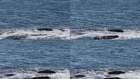 晴朗海面海浪拍打礁石蓝色海洋浪花慢镜头高清在线视频素材下载