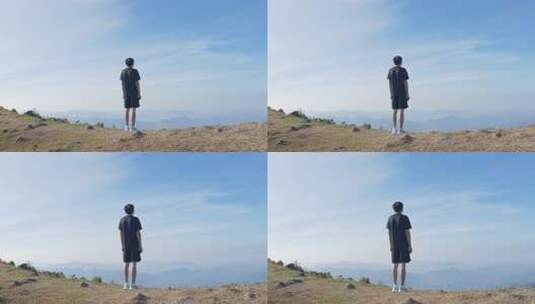 男子山顶眺望远方山峦高清在线视频素材下载