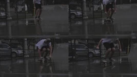 男孩在雨后滑滑板高清在线视频素材下载