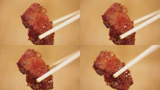 筷子夹起排骨肉高清在线视频素材下载