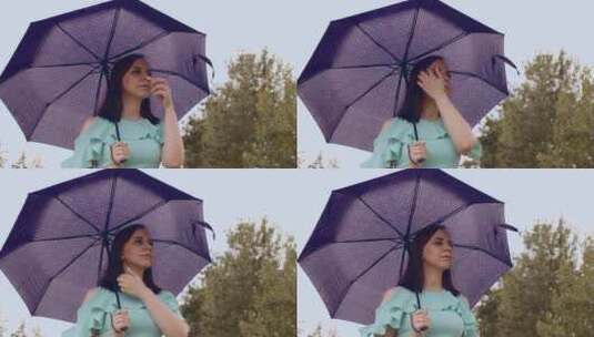 多雨天气里撑雨伞的女人高清在线视频素材下载