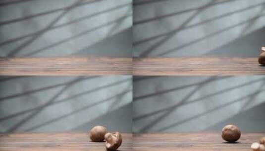 木质桌面上滚动的新鲜香菇高清在线视频素材下载