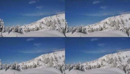 覆盖着白雪和松树的小山高清在线视频素材下载