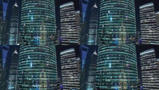 现代建筑夜晚灯光通明白领加班-上海陆家嘴高清在线视频素材下载