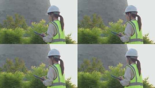 中国人女工程师戴建筑头盔工作记录高清在线视频素材下载