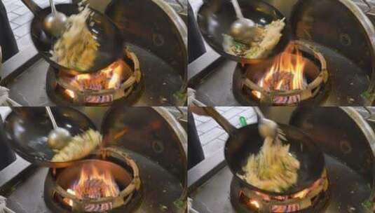 厨师用新鲜切碎的五颜六色蔬菜炒面条。高清在线视频素材下载