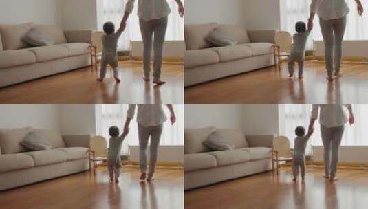 小宝宝牵着妈妈的手在家里学走路迈出第一步高清在线视频素材下载