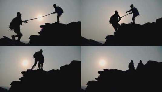 母女登山登顶夕阳剪影高清在线视频素材下载