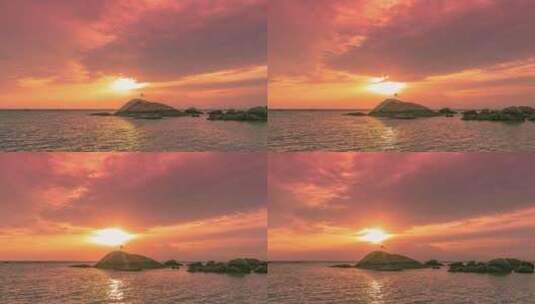 色彩斑斓的日落和美丽的云彩中的海石高清在线视频素材下载