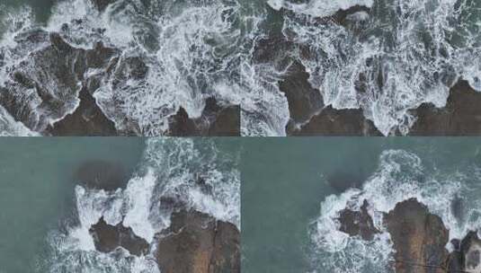 俯拍海浪拍打礁石海水冲击礁石浪花拍打岩石高清在线视频素材下载