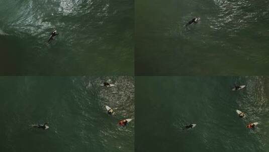 高角度航拍大海里游泳的两个人自由运动高清在线视频素材下载