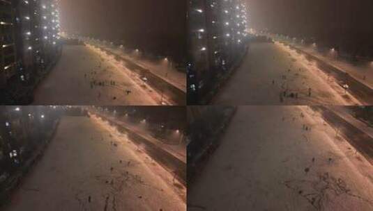 雪夜航拍玩雪的人群高清在线视频素材下载