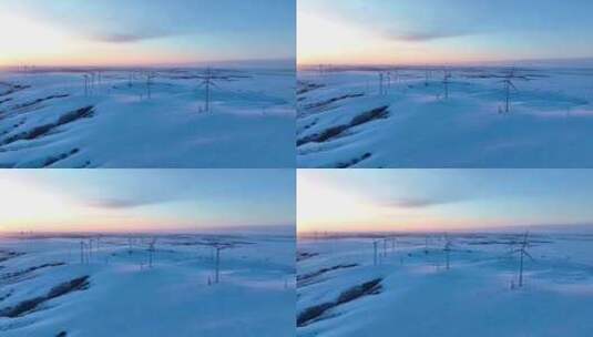 航拍呼伦贝尔冬季落日雪原风力发电清洁能源高清在线视频素材下载