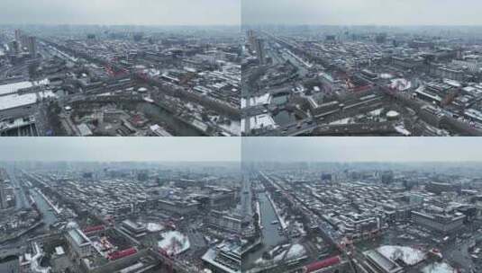航拍陕西省西安市大雪中的西安永宁门古城墙高清在线视频素材下载