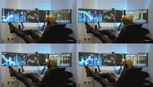 一个男人舒适地坐在三个相互连接的电脑屏幕高清在线视频素材下载