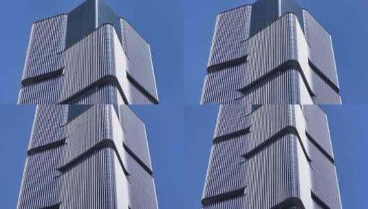 仰视高楼大厦双子塔嵌入式建筑下降高清在线视频素材下载