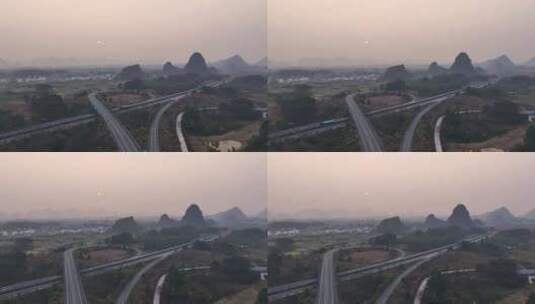 清晨日出下桂林高速公路立交桥上行驶的汽车高清在线视频素材下载
