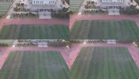 校园运动场踢足球运动航拍高清在线视频素材下载