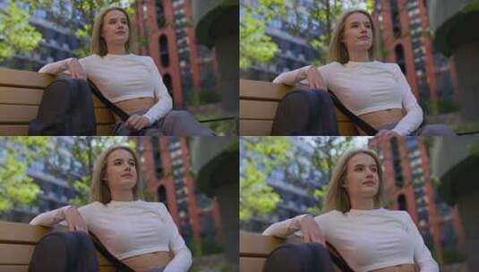 城市环境中公园长椅上放松的女人高清在线视频素材下载