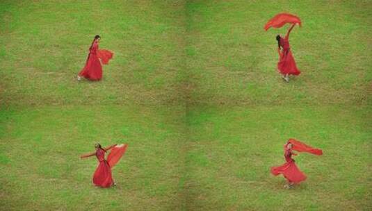 红衣女子草地起舞高清在线视频素材下载