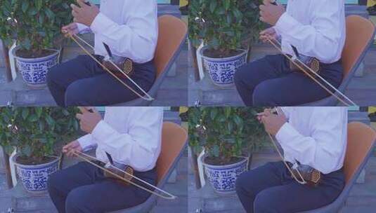 4K人文生活意境拉二胡的大爷手势特写实拍高清在线视频素材下载