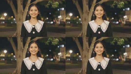 夜晚户外微笑的年轻女性高清在线视频素材下载