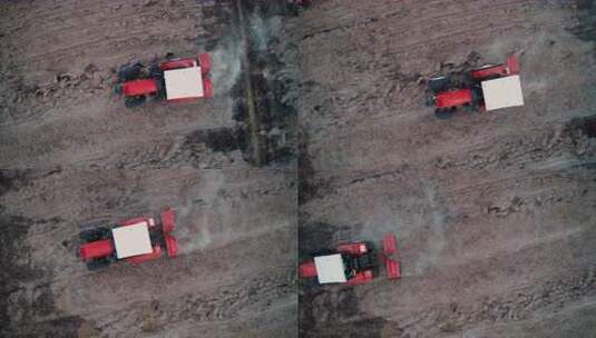 柬埔寨航拍红色拖拉机在泥土地上作业高清在线视频素材下载