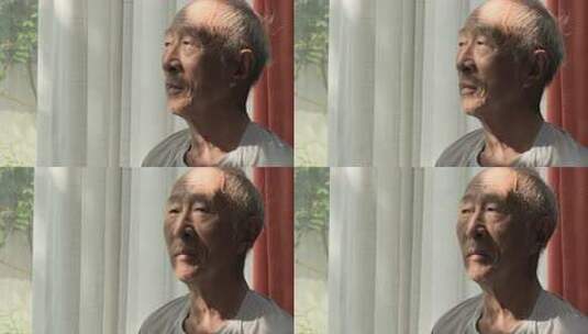 窗边老人侧脸特写高清在线视频素材下载