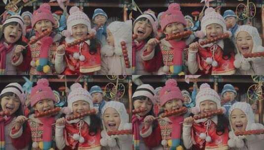 拿着糖葫芦面对着镜头微笑的女孩高清在线视频素材下载