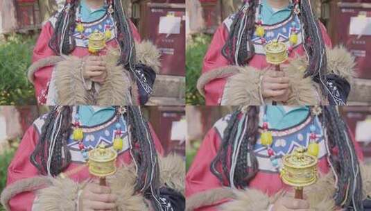 4K藏服女孩手持转经筒藏族饰品特写高清在线视频素材下载