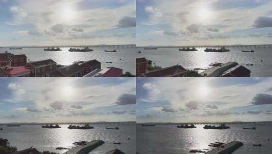 海滨城市港口风光航拍阳光下海面上的船只高清在线视频素材下载