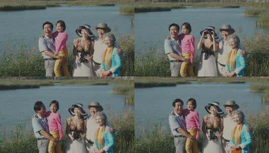一家五口在湖边草丛中观鸟高清在线视频素材下载