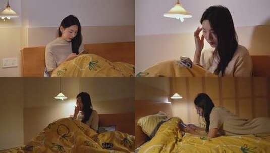 夜晚女生躺床上看手机高清在线视频素材下载