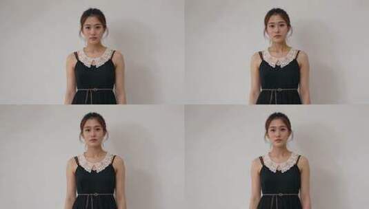 女子身着黑裙白色蕾丝领口特写高清在线视频素材下载