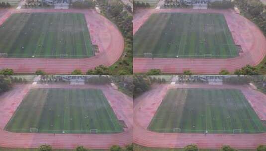校园运动场踢足球运动航拍高清在线视频素材下载