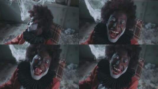 令人毛骨悚然的小丑笑着看着镜头高清在线视频素材下载