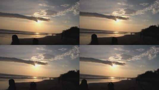 日落时海滩上人们身影高清在线视频素材下载