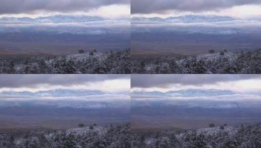 远景拍摄被雪覆盖的冬季山脉高清在线视频素材下载