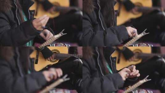 新疆手工制作者与吉他手高清在线视频素材下载