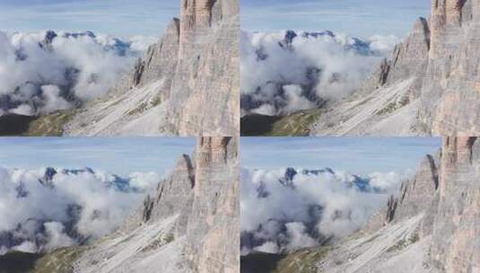 意大利多洛米蒂山脉陡峭岩石墙和低云的鸟瞰图。高清在线视频素材下载