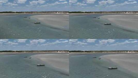 空中无人机在杰里科阿科阿拉平静的蓝色海滩上空飞行仍然波浪，船只，巴西旅游目的地高清在线视频素材下载