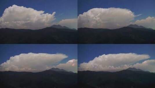 高山上的云层涌动电闪雷鸣山峰山顶晴天闪电高清在线视频素材下载