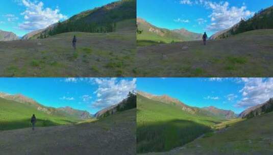 男人行走在阿勒泰山脉3高清在线视频素材下载