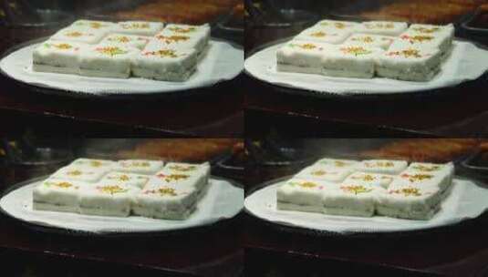 热气腾腾的中国传统风味特色糕点小吃桂花糕高清在线视频素材下载