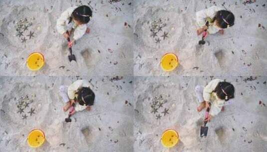 沙滩上挖沙子的儿童高视角高清在线视频素材下载