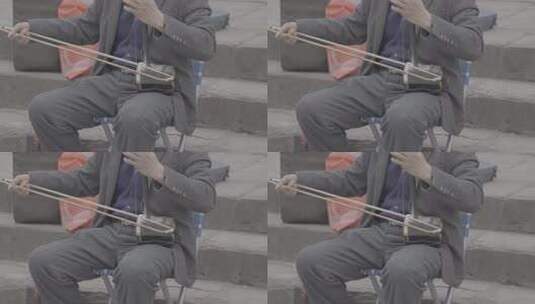 老人户外演奏二胡素材高清在线视频素材下载