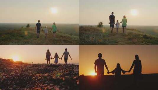 一家人夕阳下漫步草地高清在线视频素材下载