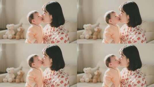 母亲亲吻怀抱中的婴儿高清在线视频素材下载